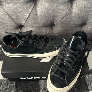 Women’s pattern leather converse sneakers.